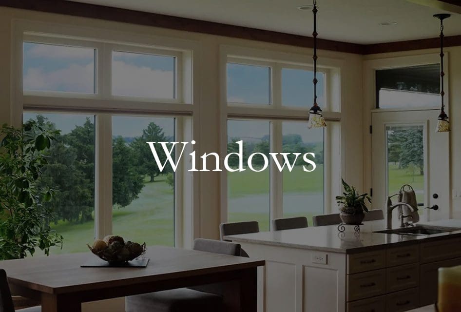 Multiple large windows in a home's kitchen showing an expertly-done home remodeling project.