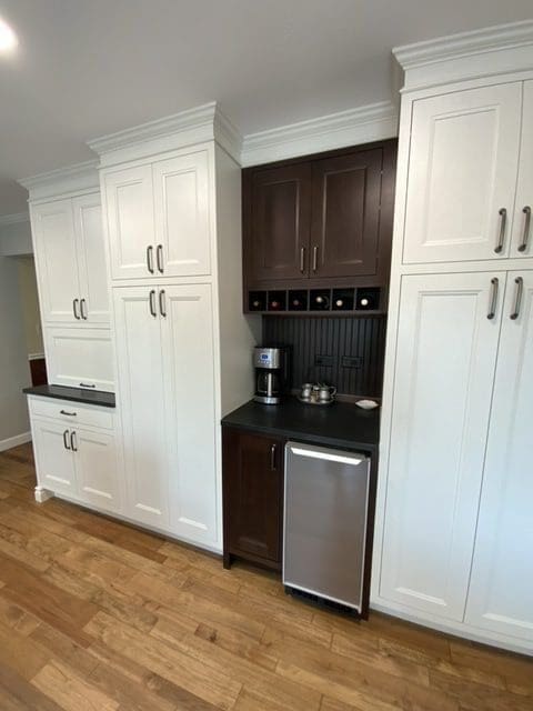 A dark-brown and white cabinetry kitchen.